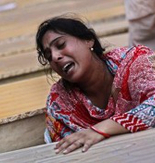 El llanto de una mujer tras el ataque suicida <br>a una iglesia de Peshawar, en Pakistán.