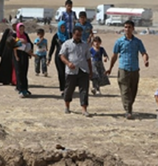 Cristianos huyendo de Mosul.